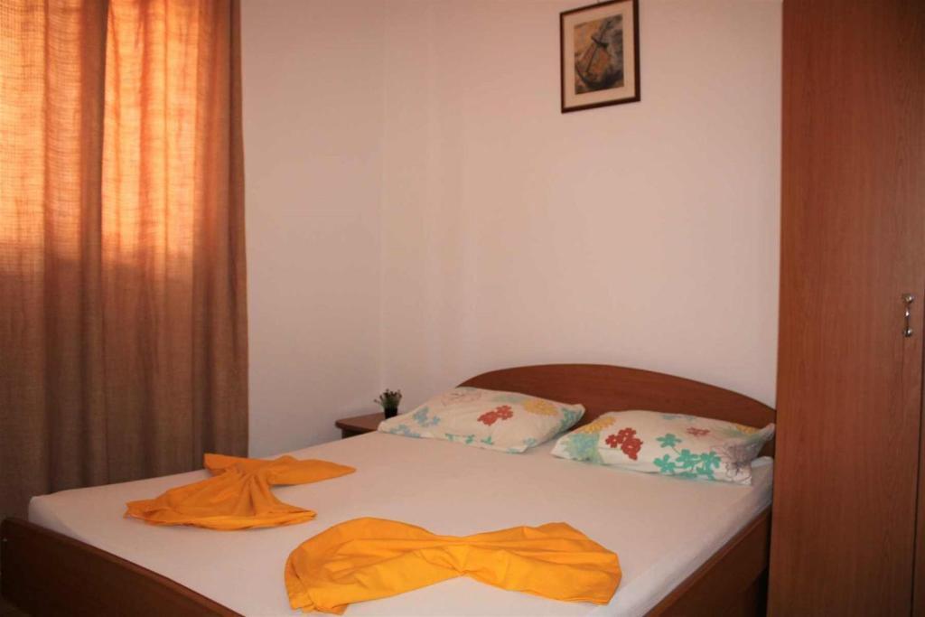 Postel nebo postele na pokoji v ubytování Apartments Pidi