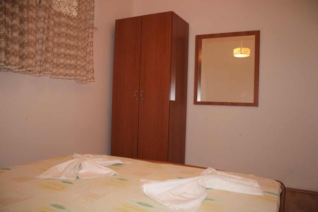 Postel nebo postele na pokoji v ubytování Apartments Pidi