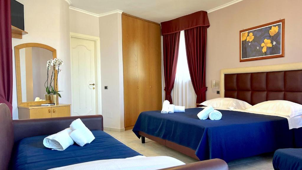 Postel nebo postele na pokoji v ubytování BAJAMAR BEACH HOTEL