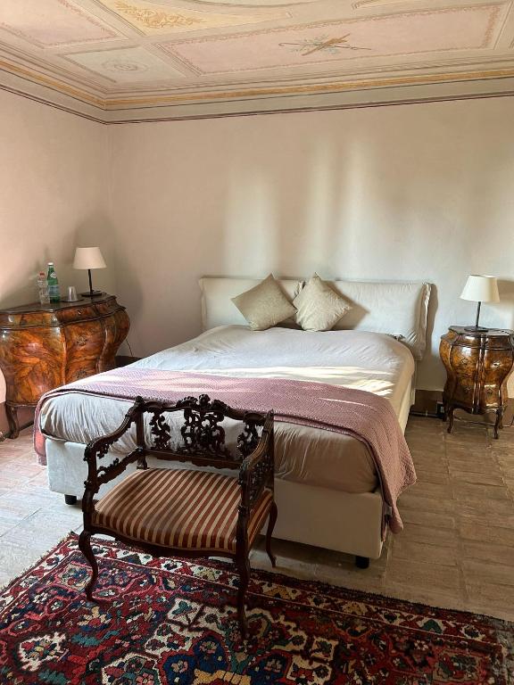 Postel nebo postele na pokoji v ubytování VILLA SACCOMANI
