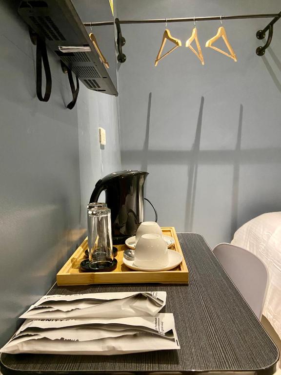 Postel nebo postele na pokoji v ubytování IAO Boutique Hotel