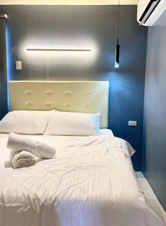 Postel nebo postele na pokoji v ubytování IAO Boutique Hotel