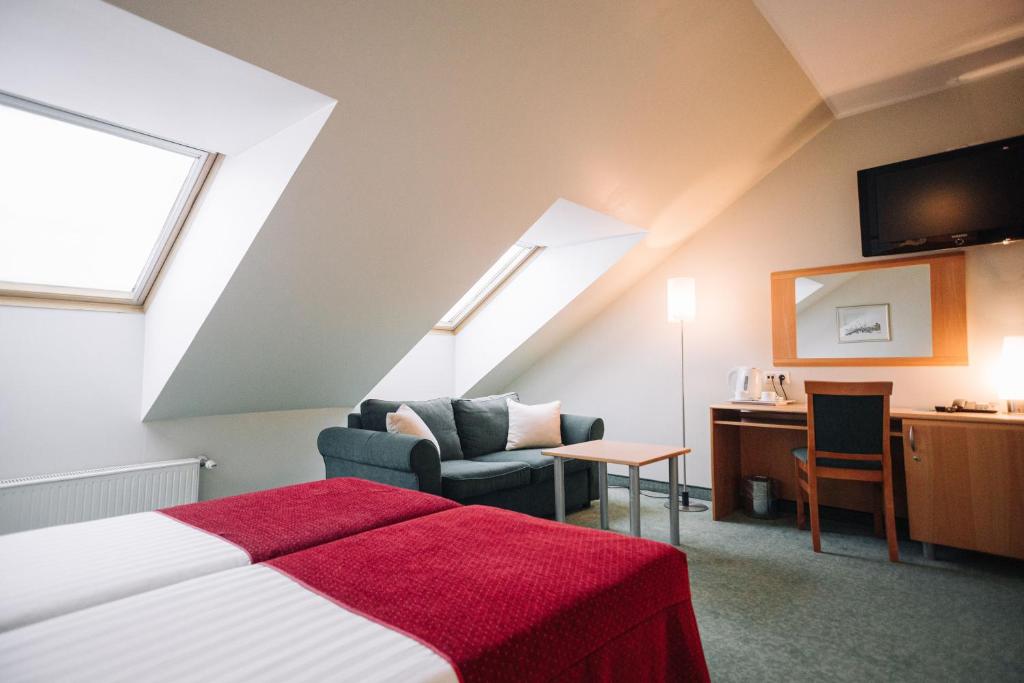 TV a/nebo společenská místnost v ubytování Rixwell Viru Square Hotel