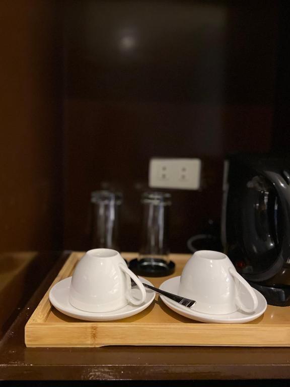 Příslušenství pro přípravu čaje a kávy v ubytování IAO Boutique Hotel