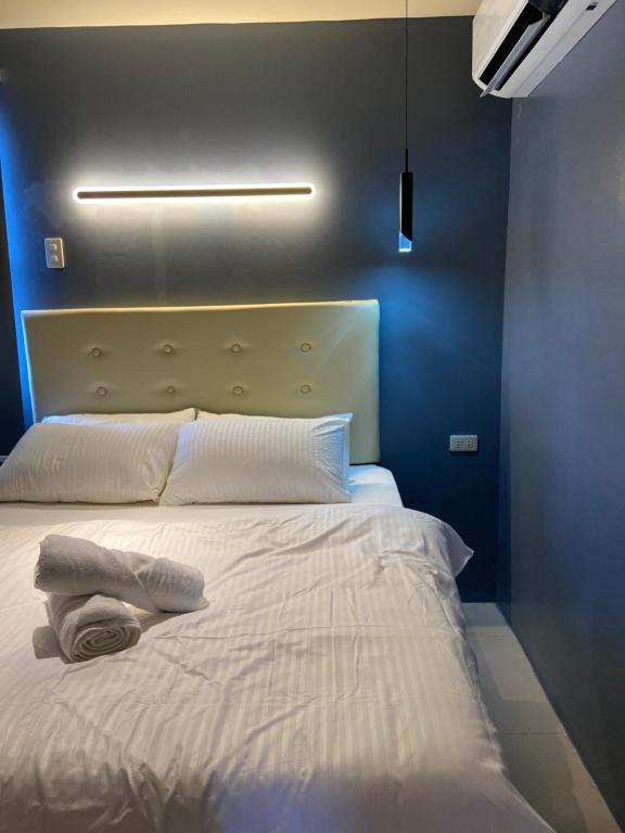 Postel nebo postele na pokoji v ubytování IAO Boutique Hotel