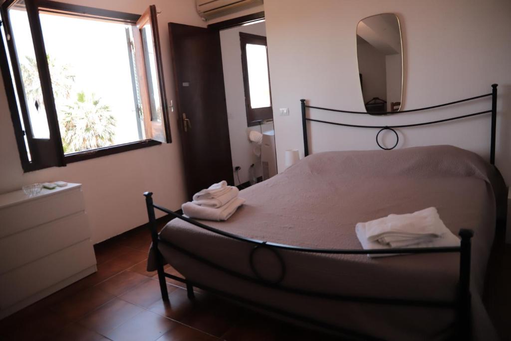 Postel nebo postele na pokoji v ubytování Sul mare di Antonietta