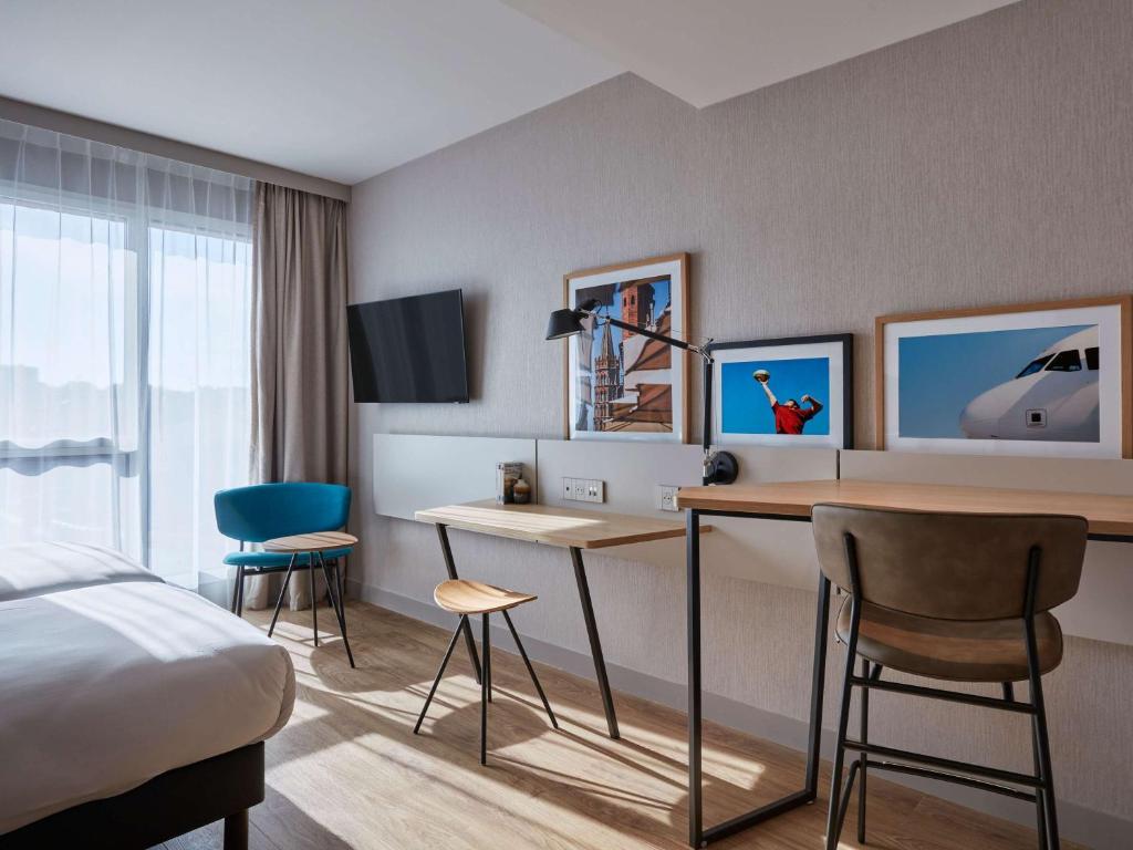 Aparthotel Adagio Original Toulouse Centre La Graveにあるテレビまたはエンターテインメントセンター