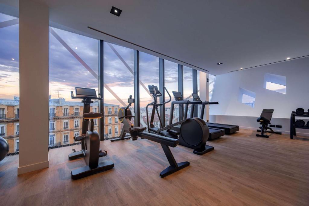 a gym with treadmills and exercise equipment in a building at Doubletree By Hilton Nice Centre Iconic in Nice