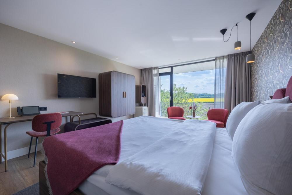 TV a/nebo společenská místnost v ubytování Van der Valk Hotel Melle - Osnabrück