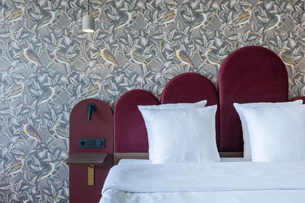 Postel nebo postele na pokoji v ubytování Van der Valk Hotel Melle - Osnabrück
