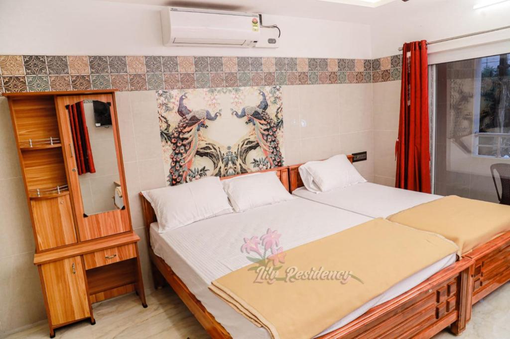 Postel nebo postele na pokoji v ubytování Lily Homestay