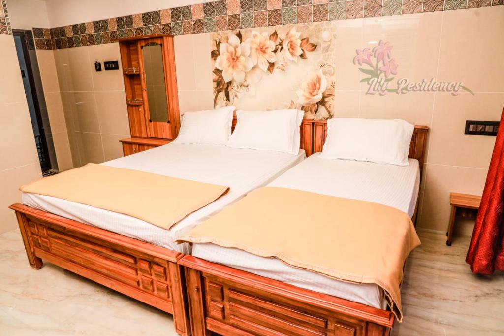 Postel nebo postele na pokoji v ubytování Lily Homestay