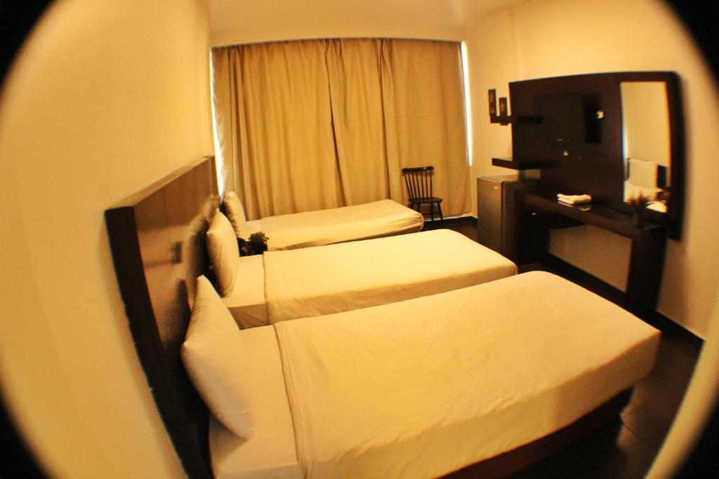 Postel nebo postele na pokoji v ubytování Le Marly Hotel