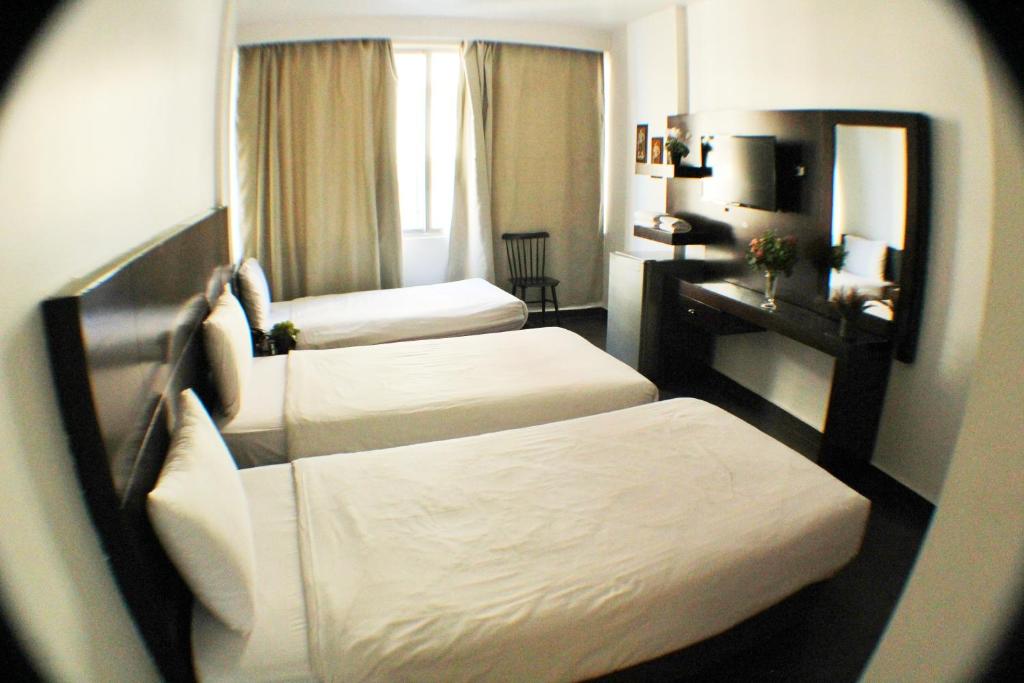 Postel nebo postele na pokoji v ubytování Le Marly Hotel