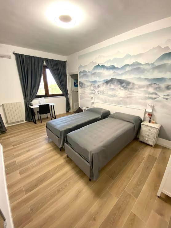 Postel nebo postele na pokoji v ubytování Villa due Scale