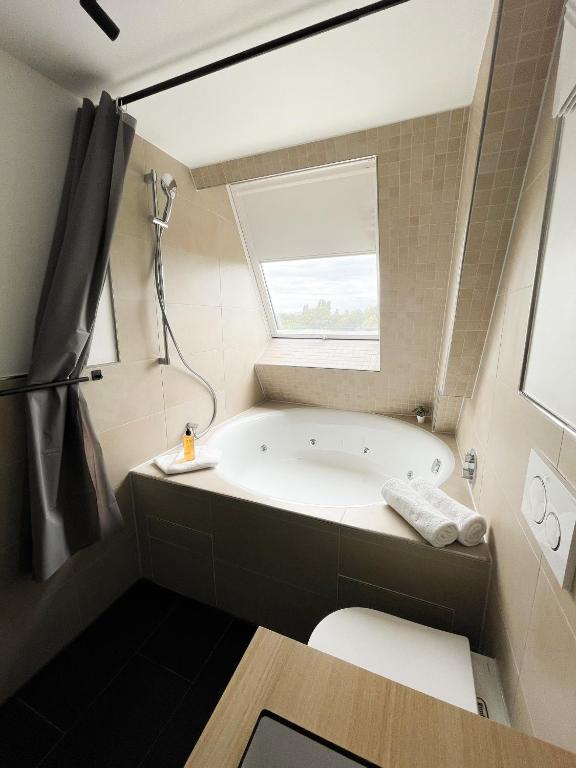 Postel nebo postele na pokoji v ubytování HOLI City Apart Hotel Berlin
