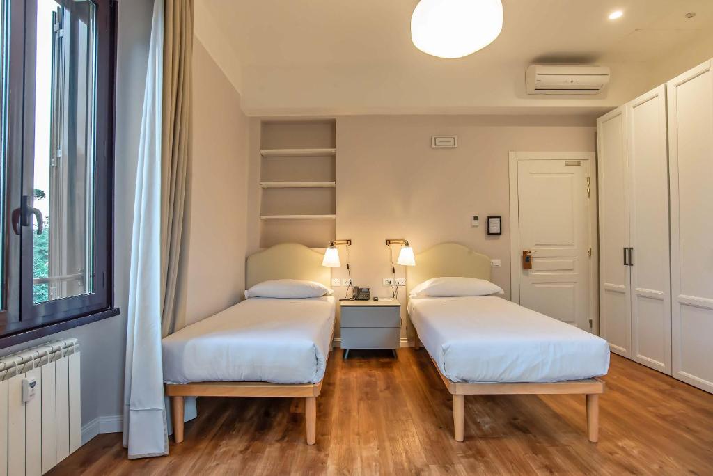 Voodi või voodid majutusasutuse HOTEL DELLE CIVETTE toas