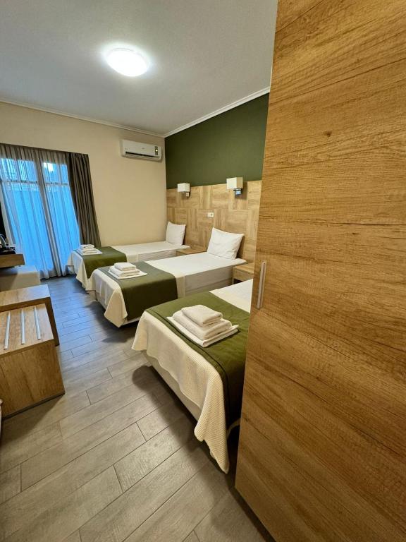 Postel nebo postele na pokoji v ubytování Konaki Ouranoupolis