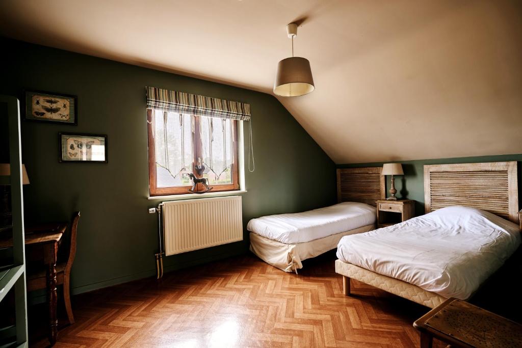 Postel nebo postele na pokoji v ubytování Gîte des Crêtes