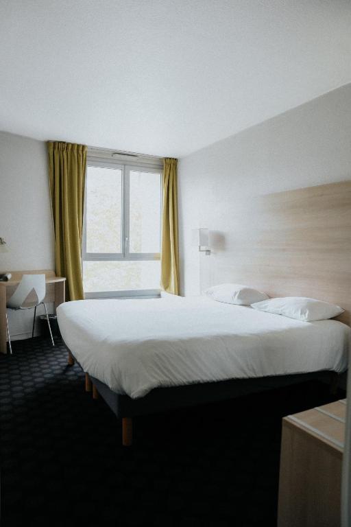 Postel nebo postele na pokoji v ubytování Hôtel d'Orsay