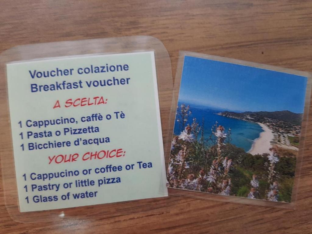 a book sitting on a table with a picture of a beach at B&B Is Pranus a Mari Casa Privata in Solanas