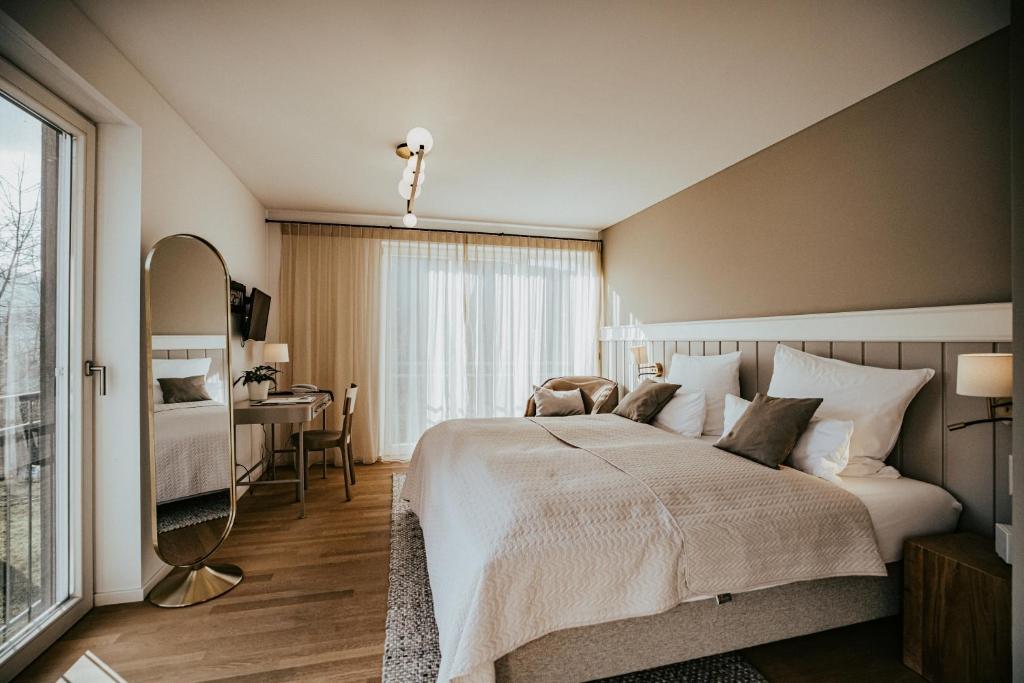 Postel nebo postele na pokoji v ubytování Landgasthof Jagstmühle