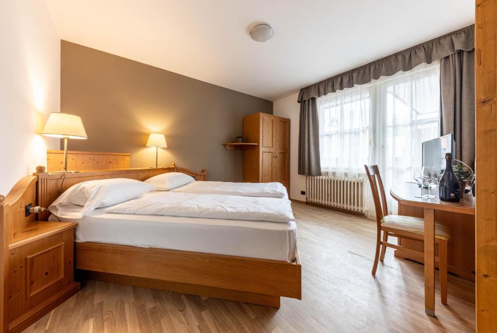 Postel nebo postele na pokoji v ubytování WHITE MOSS GARNì
