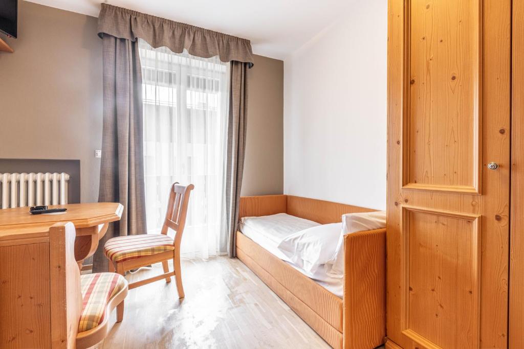 Postel nebo postele na pokoji v ubytování WHITE MOSS GARNì