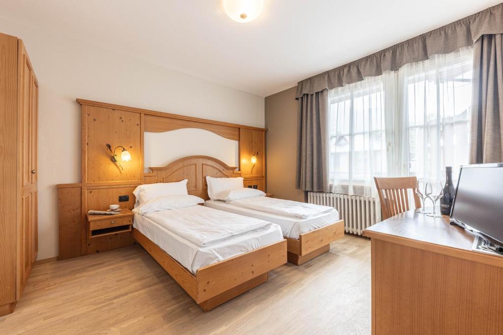 Postel nebo postele na pokoji v ubytování WHITE MOSS GARNì