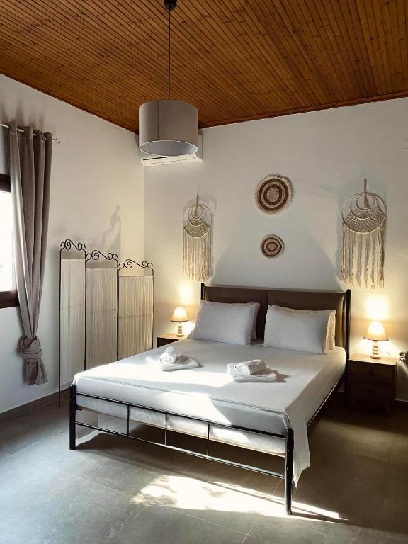 Postel nebo postele na pokoji v ubytování Moxy Paxos - Cozy Home