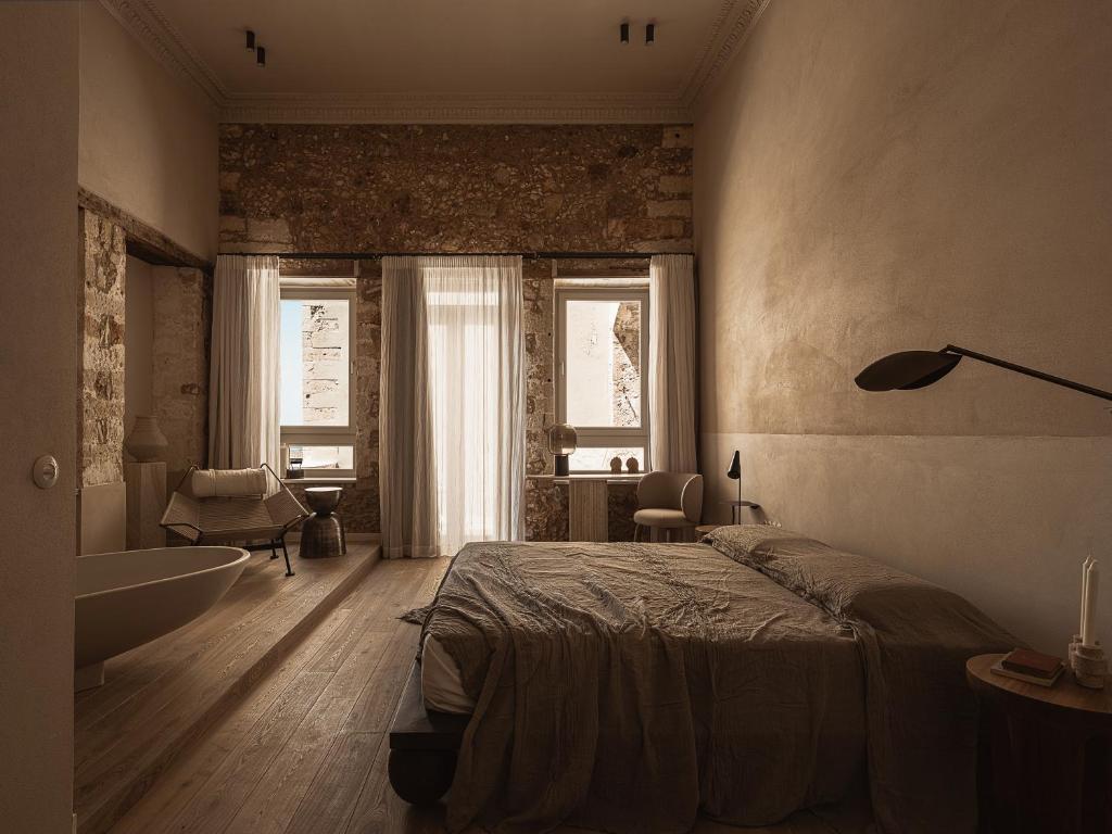 Postel nebo postele na pokoji v ubytování Aisha Hotel