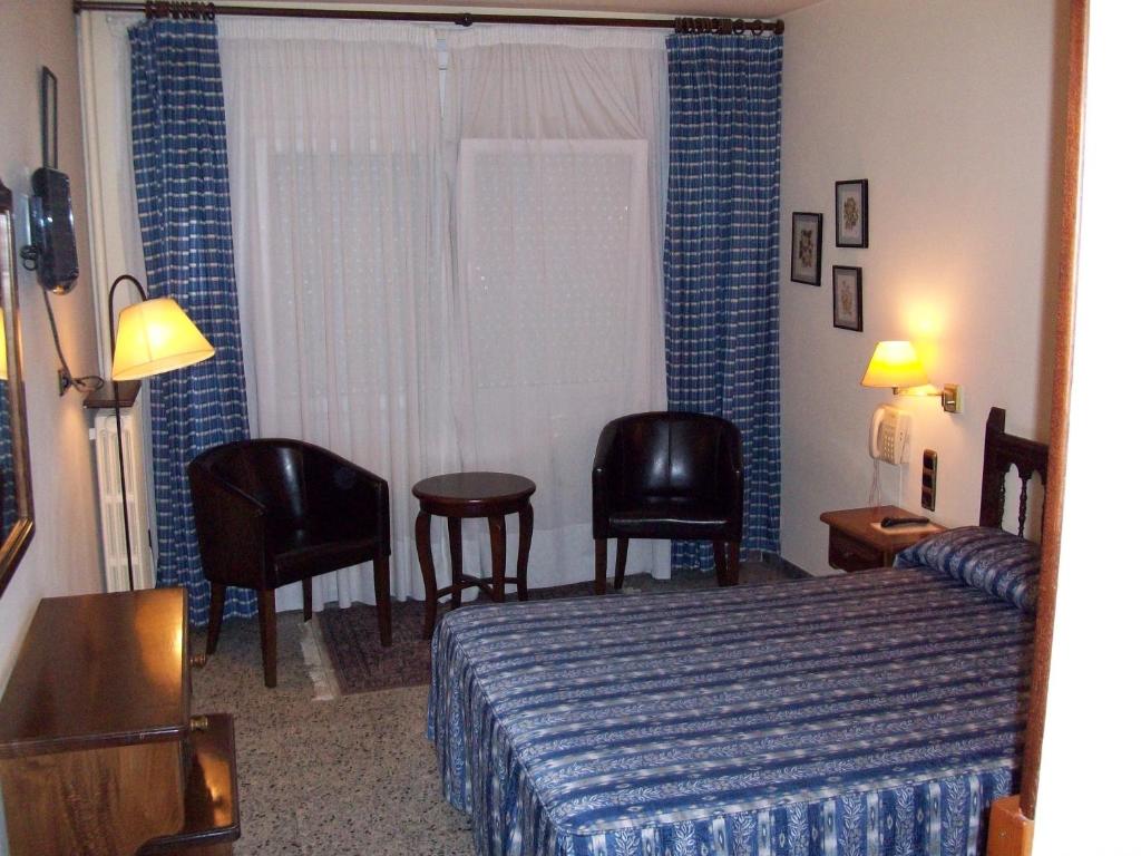 Postel nebo postele na pokoji v ubytování Hotel Delavall
