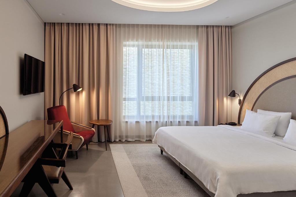Postel nebo postele na pokoji v ubytování Neringa Hotel