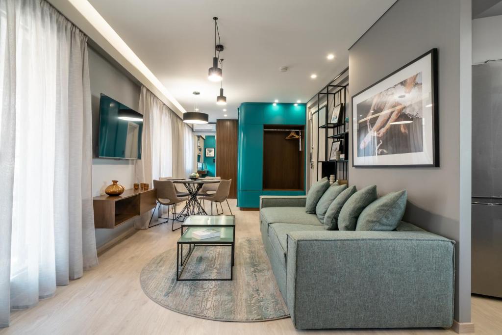 a living room with a couch and a table at Evripidou Suites in Athens