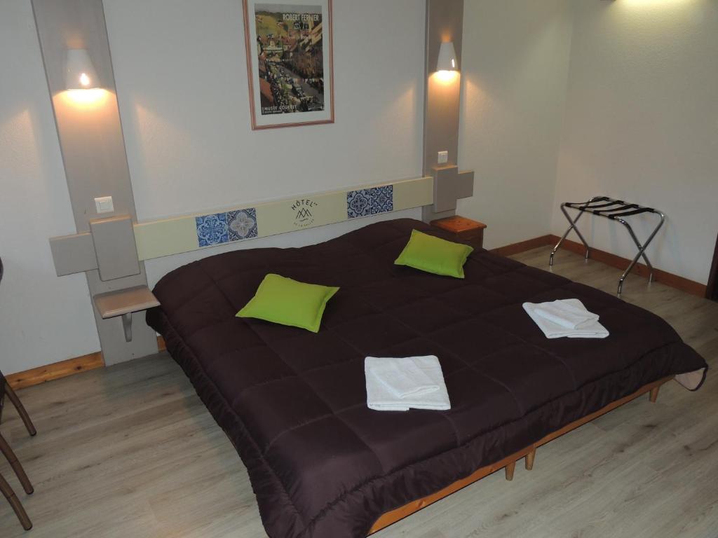 Postel nebo postele na pokoji v ubytování Hôtel de La Vallée