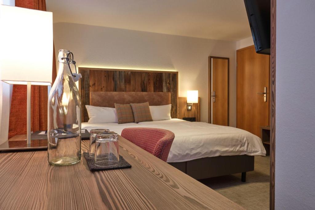 Krevet ili kreveti u jedinici u okviru objekta Genuss- & Aktivhotel Sonnenburg