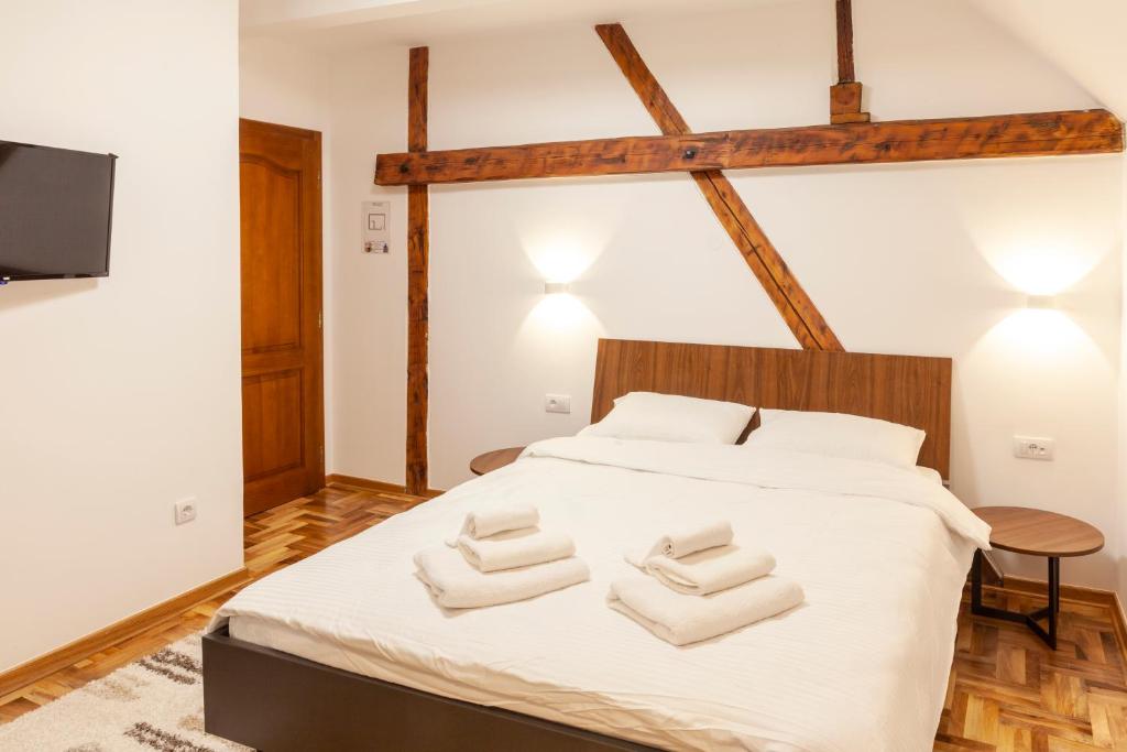 Postel nebo postele na pokoji v ubytování Prenoćište Omega Luxury