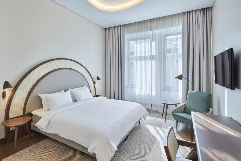 Postel nebo postele na pokoji v ubytování Neringa Hotel