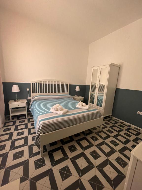 Postel nebo postele na pokoji v ubytování DONNA MARIA