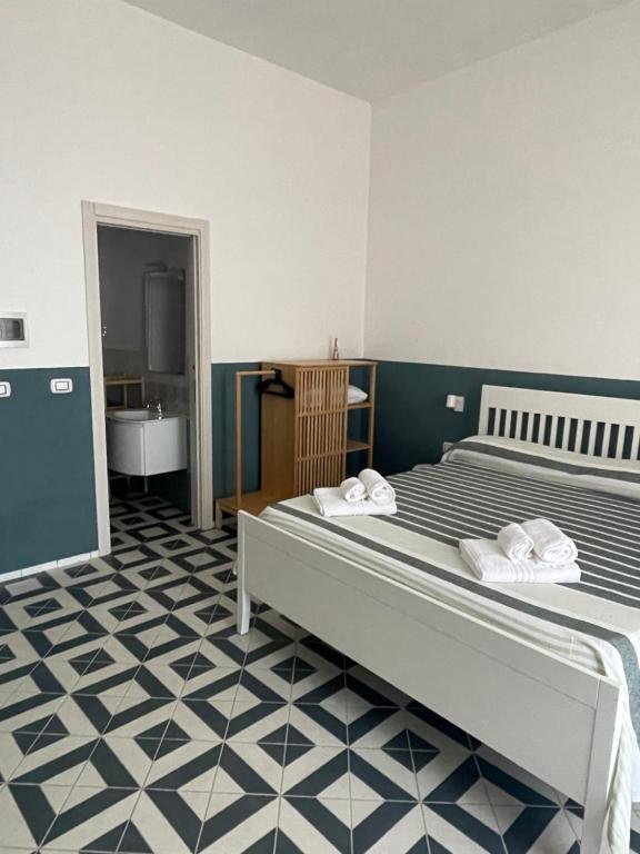 Postel nebo postele na pokoji v ubytování DONNA MARIA