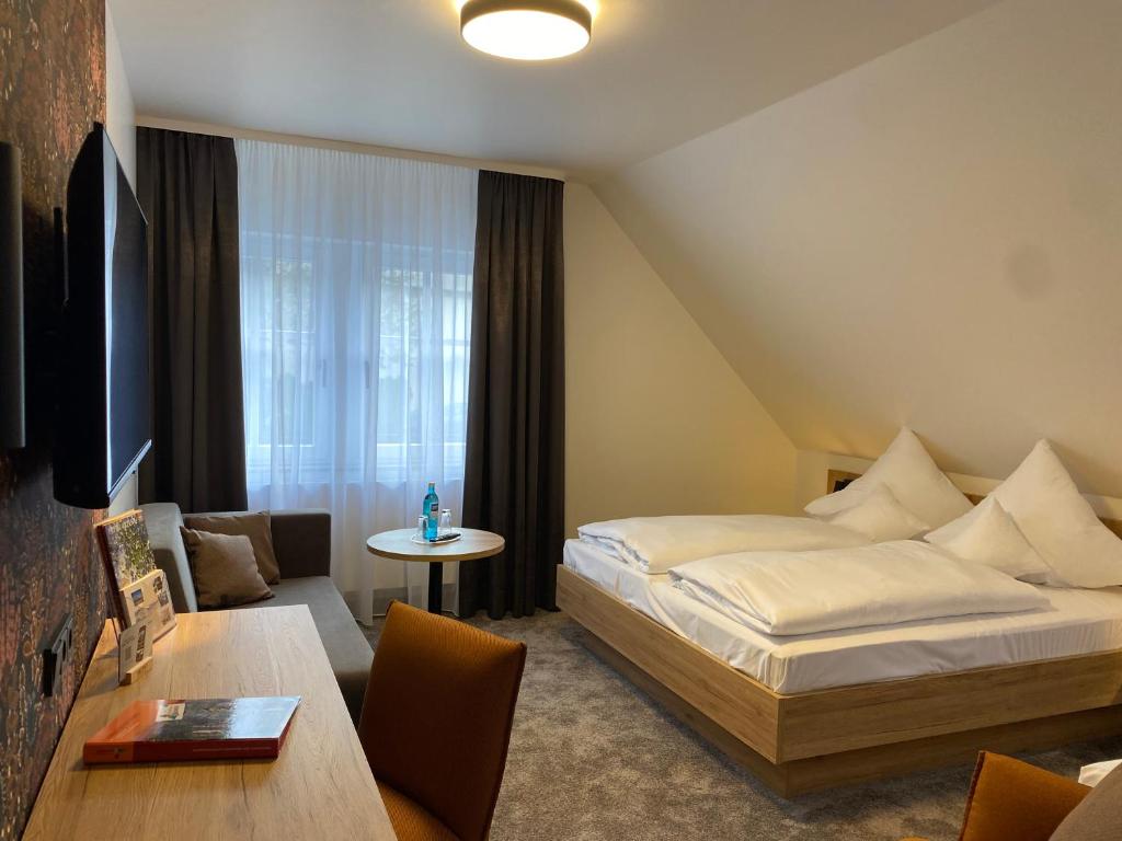 Postel nebo postele na pokoji v ubytování Akzent Hotel Schranne