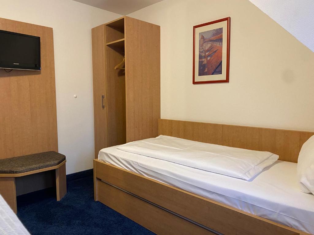 Postel nebo postele na pokoji v ubytování Akzent Hotel Schranne