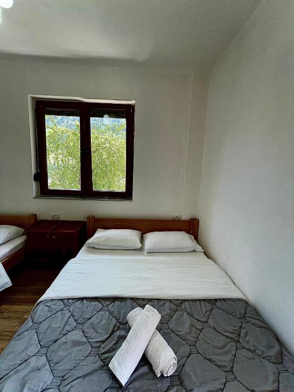 Postel nebo postele na pokoji v ubytování LAZER ÇARDAKU Guesthouse
