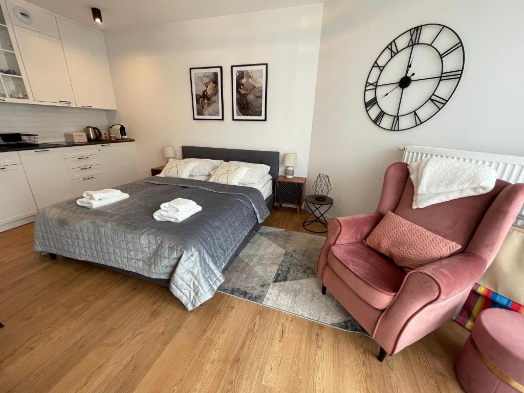 Postel nebo postele na pokoji v ubytování Apartament Różowa Fala - Pinea Pobierowo