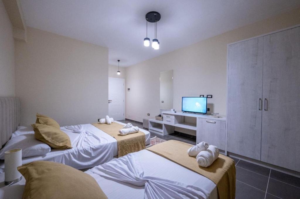 Postel nebo postele na pokoji v ubytování Altobelo Hotel