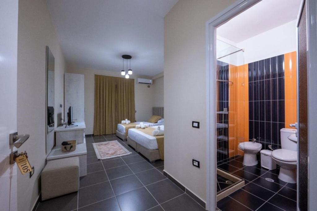 Postel nebo postele na pokoji v ubytování Altobelo Hotel