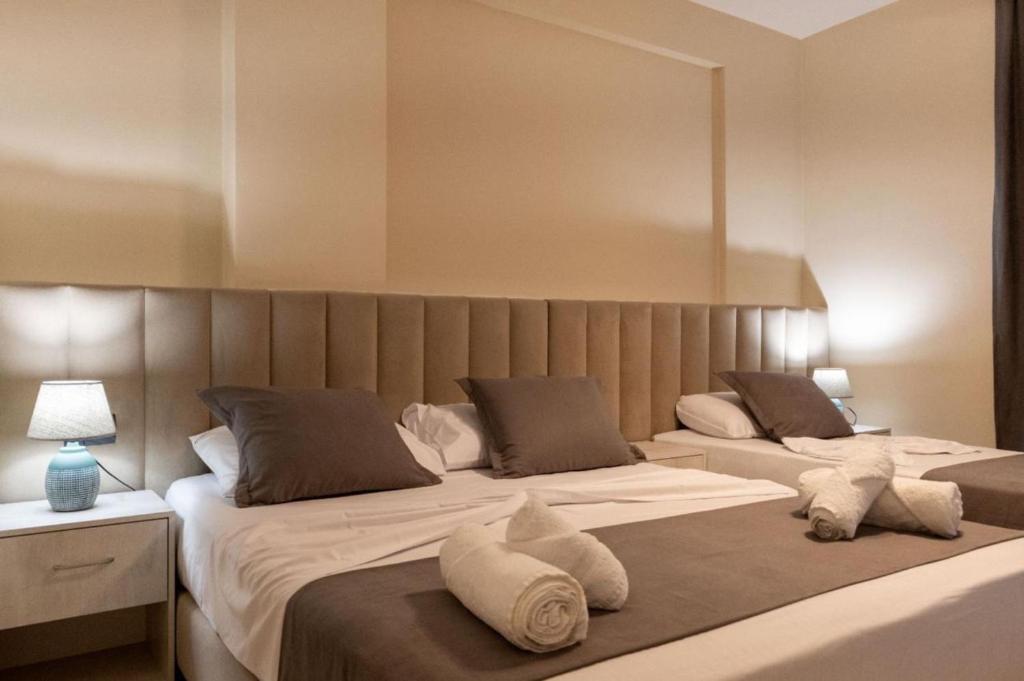 Postel nebo postele na pokoji v ubytování Altobelo Hotel