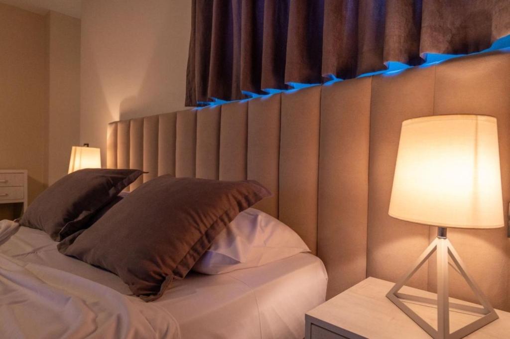Postel nebo postele na pokoji v ubytování Altobelo Hotel