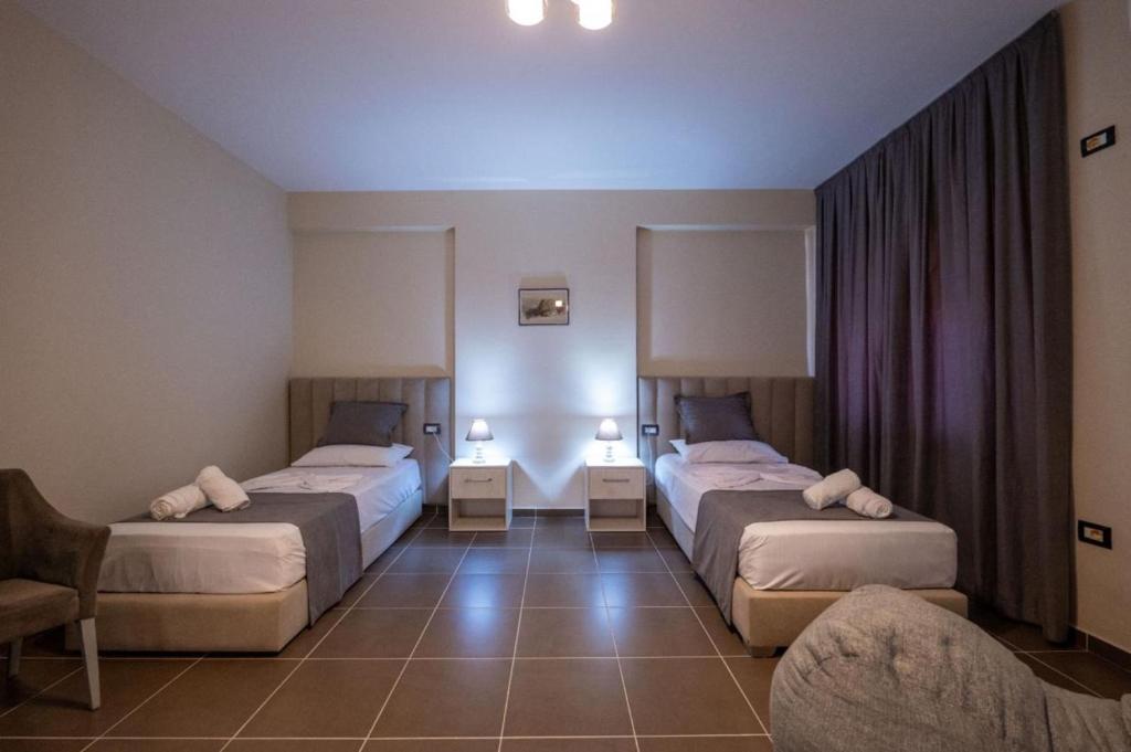 Postel nebo postele na pokoji v ubytování Altobelo Hotel