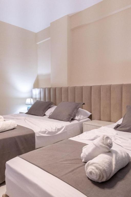 Postel nebo postele na pokoji v ubytování Altobelo Hotel